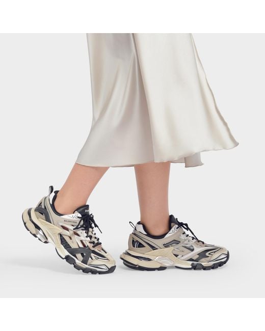 beige and black sneakers