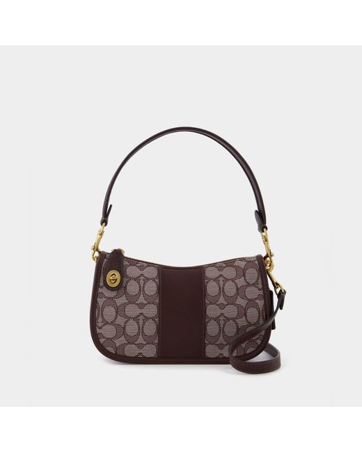 coach swinger bag in signature jacquard brown