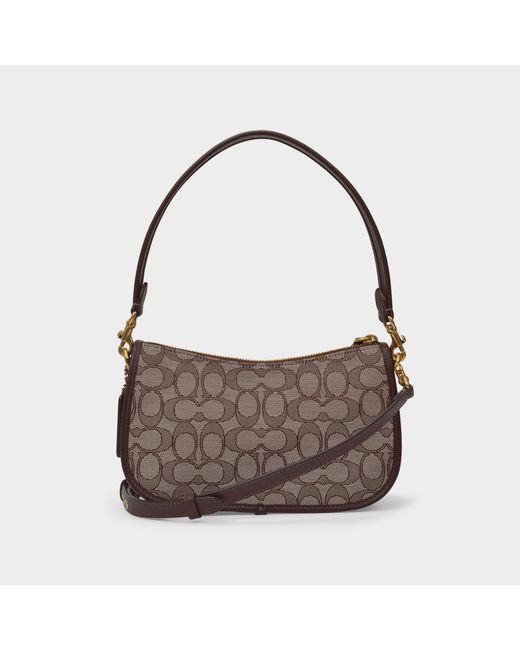 coach swinger bag in signature jacquard brown