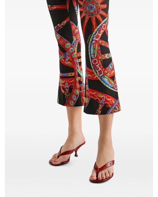 Dolce & Gabbana Red Silk Pants With Cart Print