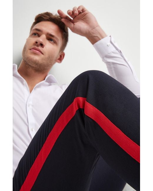 trousers with red side stripe