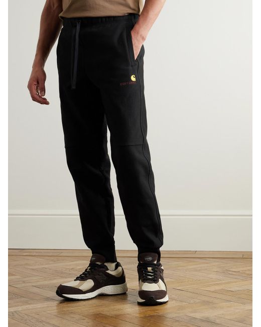 Carhartt American Script schmal zulaufende Jogginghose aus Jersey aus einer Baumwollmischung in Black für Herren