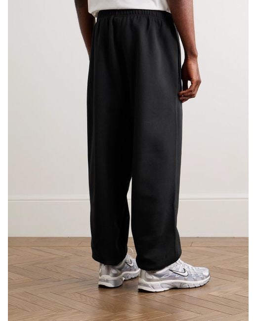Nike Solo Swoosh schmal zulaufende Jogginghose aus Jersey aus einer Baumwollmischung mit Logostickerei in Black für Herren