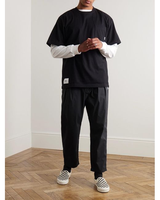 (w)taps Blue Tapered Logo-Appliquéd Cotton-Blend Trousers for men