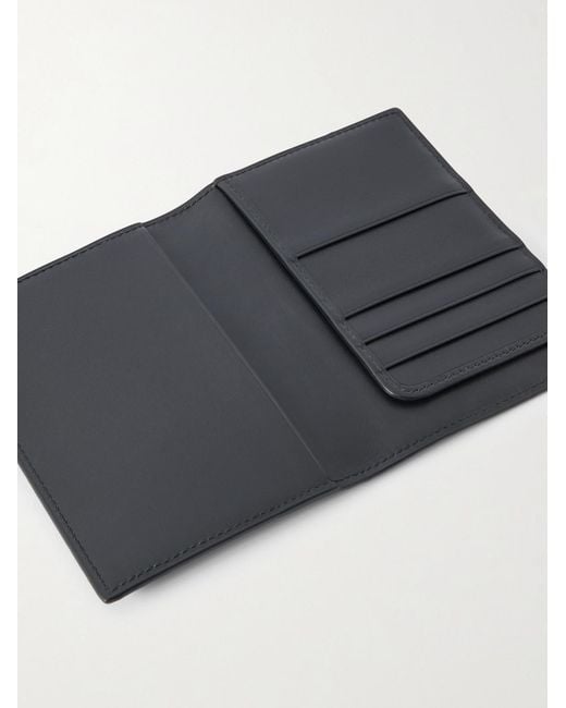 Arabella Logo-Debossed Leather Passport Case di Gucci in Black da Uomo