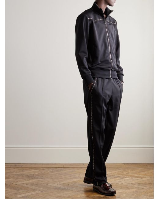 Pantaloni sportivi in jersey tecnico con borchie di Palm Angels in Black da Uomo