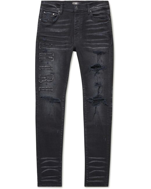 Amiri Denim Skinny-fit Logo-appliquéd Distressed Jeans in Black for Men ...