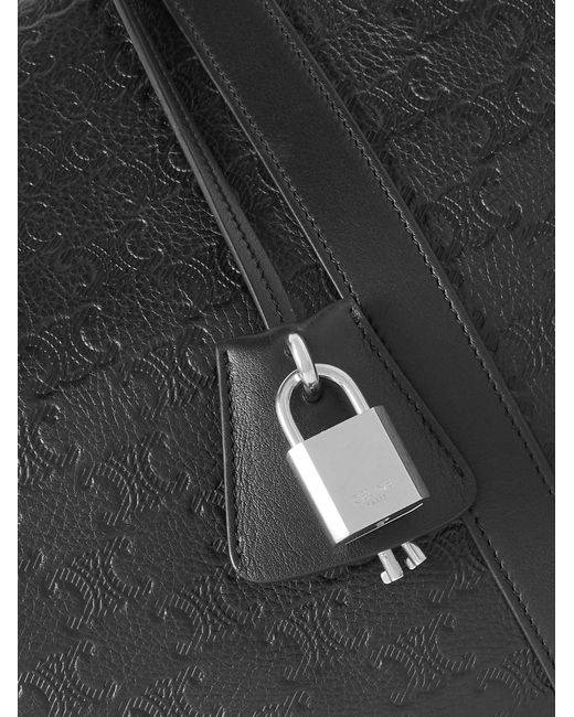 Medium Voyage Logo-Debossed Leather Holdall di Céline in Black da Uomo