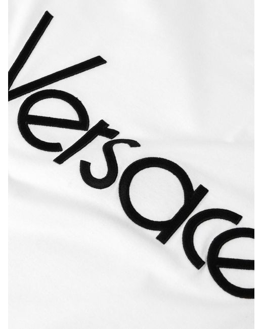 T-shirt in jersey di cotone con logo ricamato di Versace in Natural da Uomo