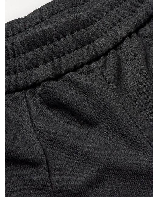 Pantaloni sportivi in jersey tecnico con borchie di Palm Angels in Black da Uomo