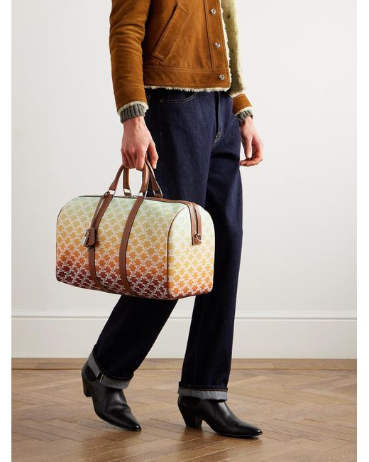 Medium Voyage Leather-Trimmed Logo-Print Coated-Canvas Holdall di Céline in Natural da Uomo