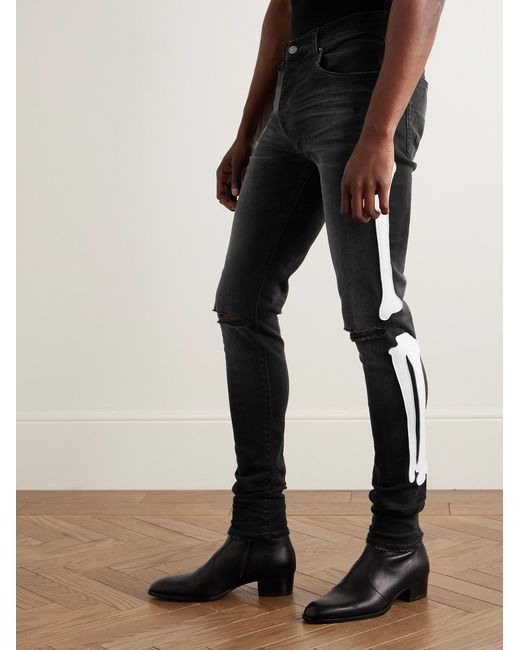 Amiri Black Bones Skinny-Fit Appliquéd Distressed Jeans for men