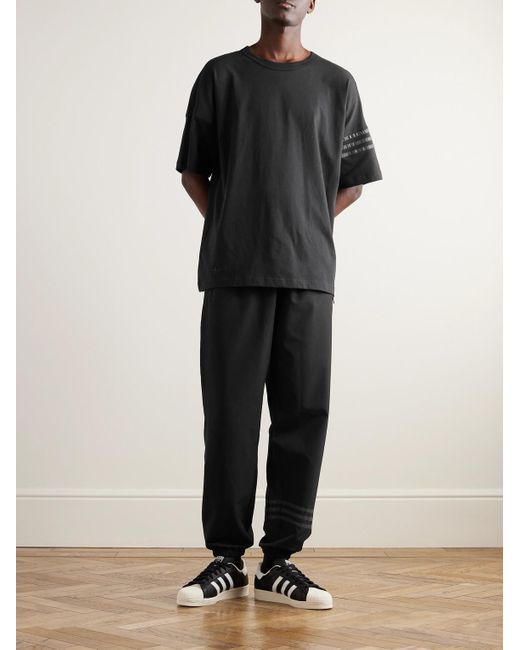 Pantaloni sportivi a gamba affusolata con righe Neuclassic di Adidas Originals in Black da Uomo