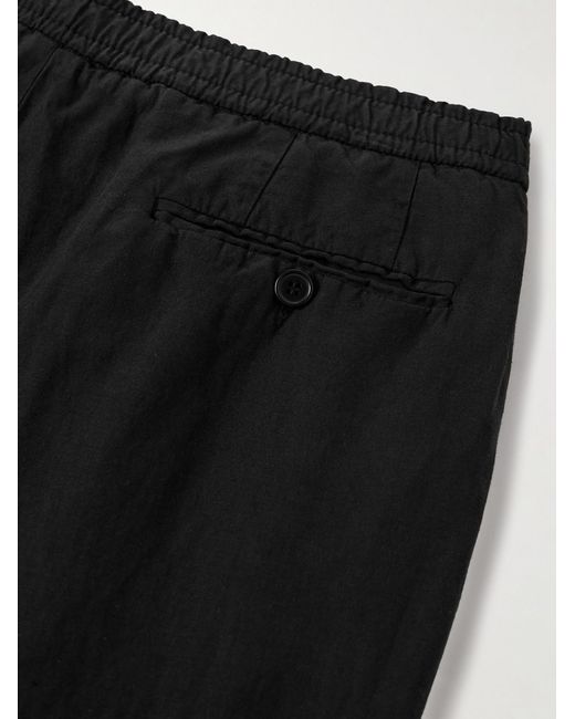 Officine Generale Black Drew Tapered Pleated Garment-Dyed Lyocell-Blend Trousers for men