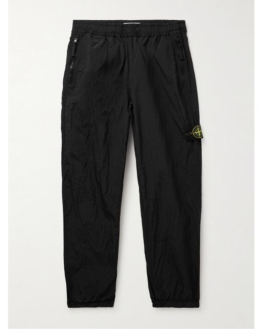 Pantaloni a gamba affusolata in Nylon Metal ECONYL® con logo applicato di Stone Island in Black da Uomo