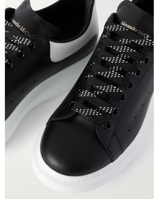 McQueen Black Exaggerated-Sole Studded Leather Sneakers for men