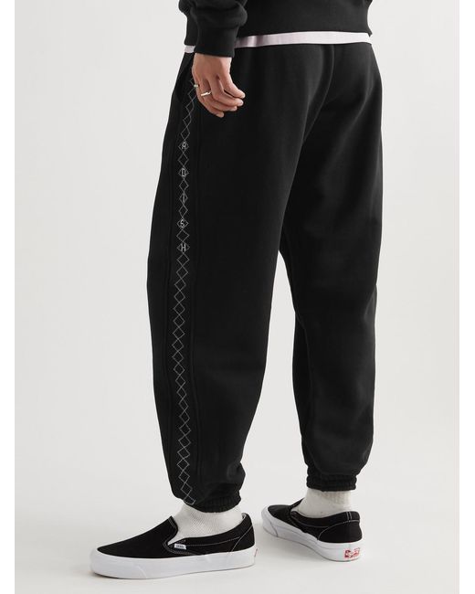 Adish Black Tapered Logo-embroidered Cotton-jersey Sweatpants for men