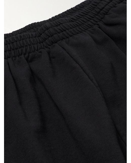 Balenciaga Weit geschnittene Jogginghose aus Baumwoll-Jersey mit Logostickereien in Black für Herren