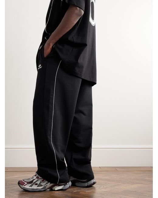 Balenciaga Weit geschnittene Jogginghose aus Baumwoll-Jersey mit Logostickereien in Black für Herren