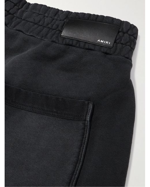 Amiri Black Straight-leg Logo-flocked Distressed Cotton-jersey Drawstring Shorts for men