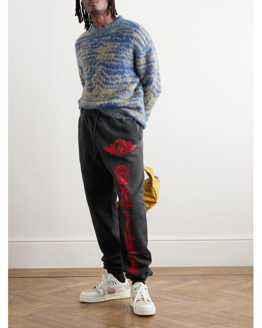 Pantaloni sportivi a gamba affusolata in jersey di cotone con logo Angel of Death di SAINT Mxxxxxx in Blue da Uomo