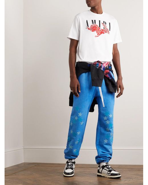 Amiri Blue Tapered Leather-Appliquéd Supima Cotton-Jersey Sweatpants for men