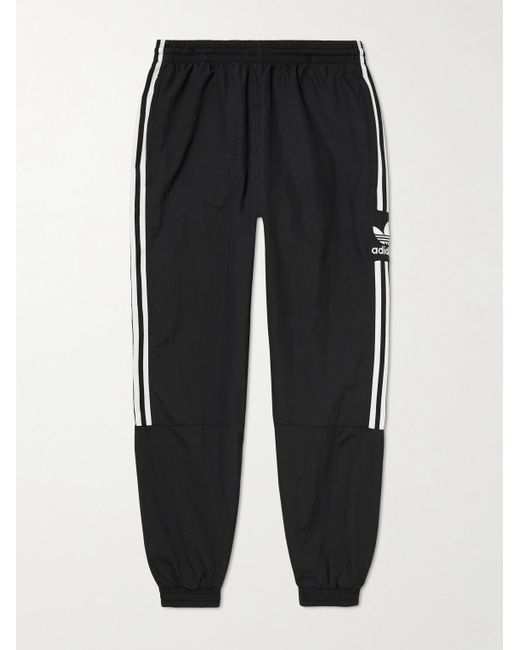 Adidas Originals Black Lock Up Tapered Logo-embroidered Striped Recycled Shell Sweatpants for men