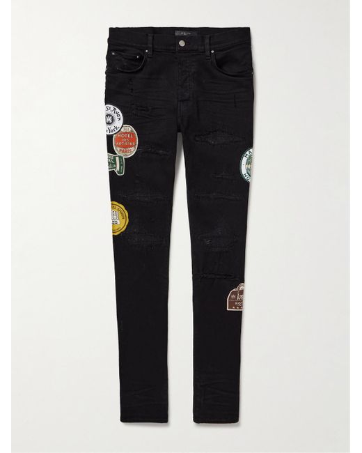 Jeans skinny effetto consumato con applicazioni di Amiri in Black da Uomo