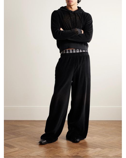 Pantaloni sportivi a gamba larga in velour di misto cotone con logo goffrato Fega di Acne in Black da Uomo
