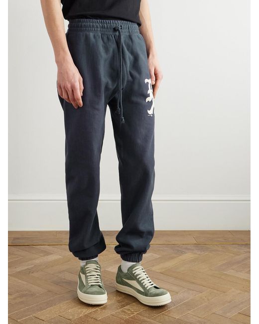 SAINT Mxxxxxx Blue Tapered Logo-Print Cotton-Blend Jersey Sweatpants for men