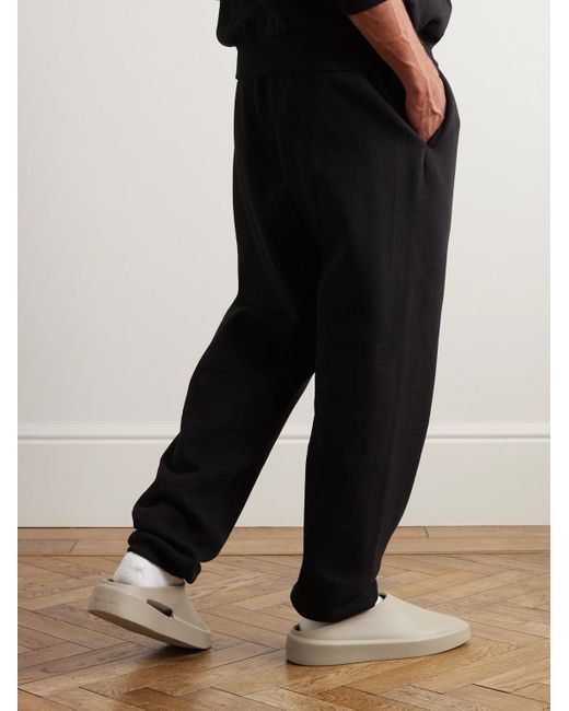 Fear of God ESSENTIALS Black Logo-appliquéd Cotton-blend Jersey Sweatpants for men