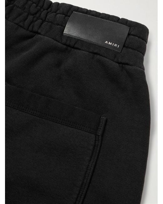 Pantaloni sportivi a gamba larga in jersey di cotone con logo floccato di Amiri in Black da Uomo