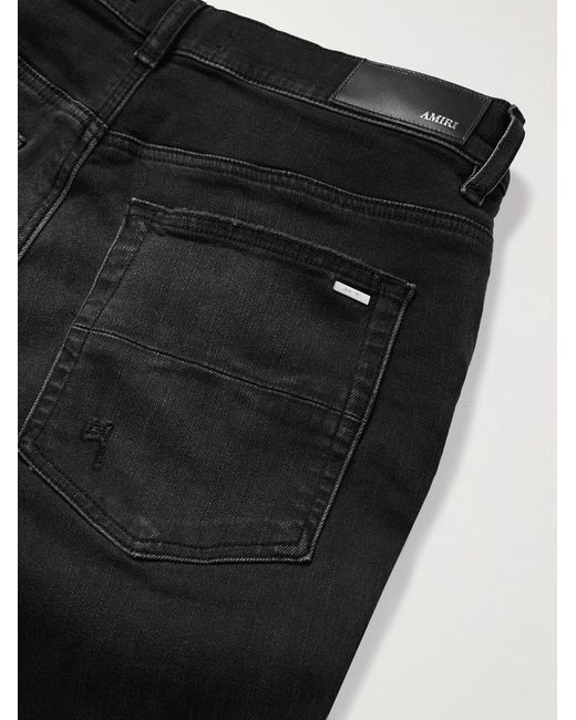 Amiri Black Bones Skinny-Fit Appliquéd Distressed Jeans for men