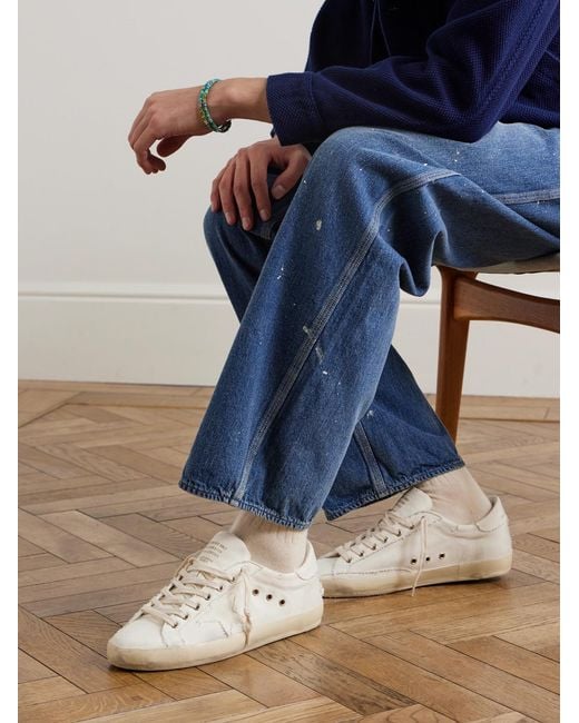 Golden Goose Deluxe Brand Natural Super-Star Distressed Canvas Sneakers for men
