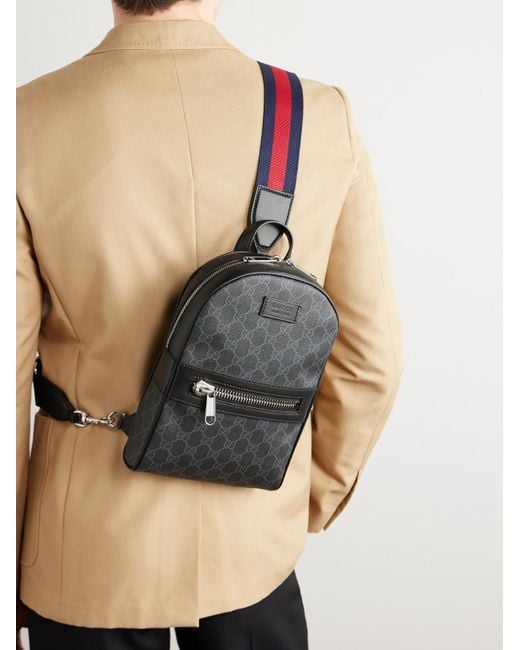 Gucci Black Leather-trimmed Monogrammed Coated-canvas Sling Backpack for men