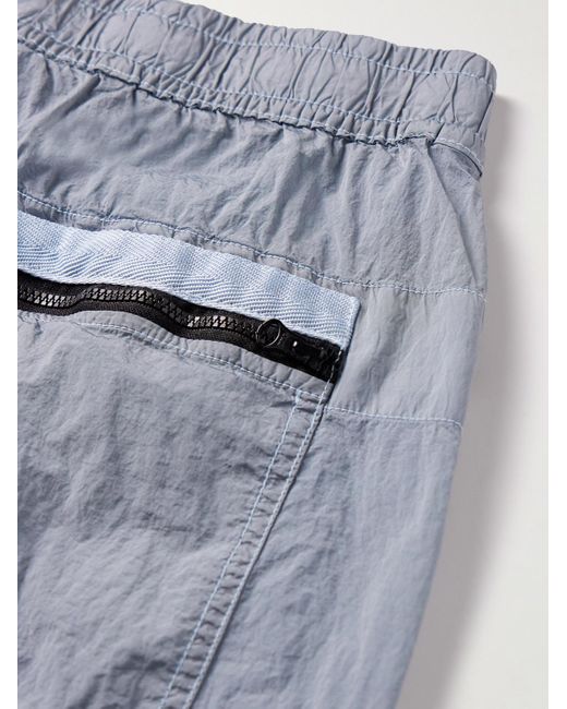 Stone Island Blue Tapered Logo-appliquéd Econyl® Nylon Metal Trousers for men