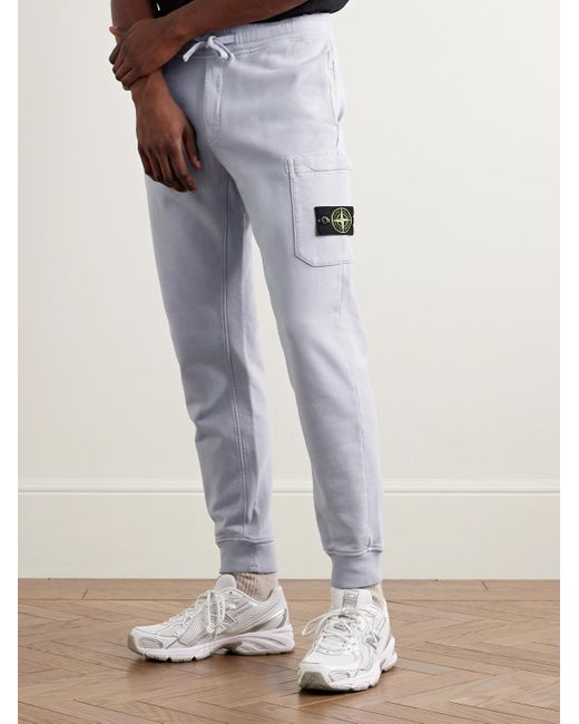 Stone Island Blue Tapered Logo-Appliquéd Garment-Dyed Cotton-Jersey Sweatpants for men