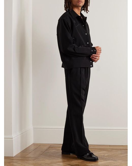 Pantaloni svasati slim-fit in jersey tecnico con logo ricamato Cowboy di Needles in Black da Uomo