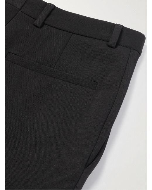 Pantaloni a gamba affusolata in lana grain de poudre con finiture in seta di Saint Laurent in Black da Uomo