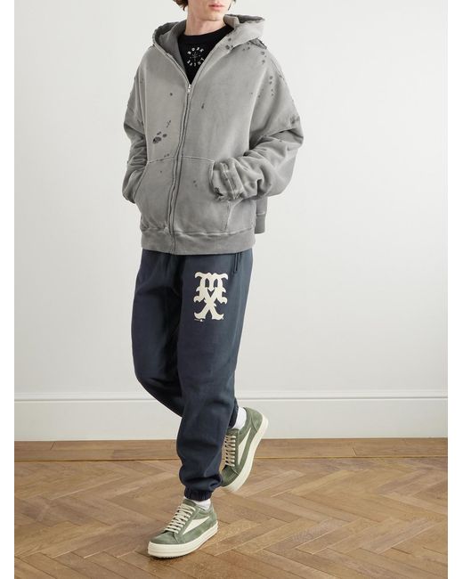 SAINT Mxxxxxx Blue Tapered Logo-Print Cotton-Blend Jersey Sweatpants for men