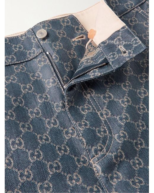 Jeans cargo a gamba dritta in denim spalmato con logo jacquard di Gucci in Blue da Uomo