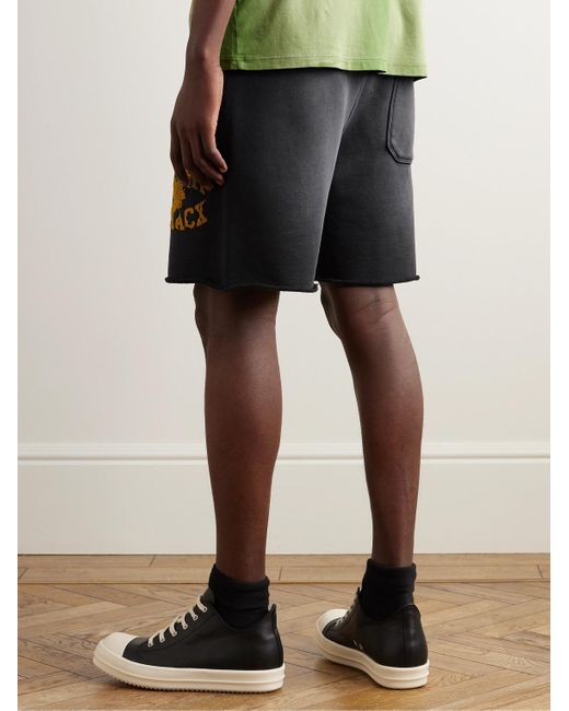 Shorts a gamba dritta in jersey di cotone effetto consumato con coulisse e logo floccato di Amiri in Black da Uomo