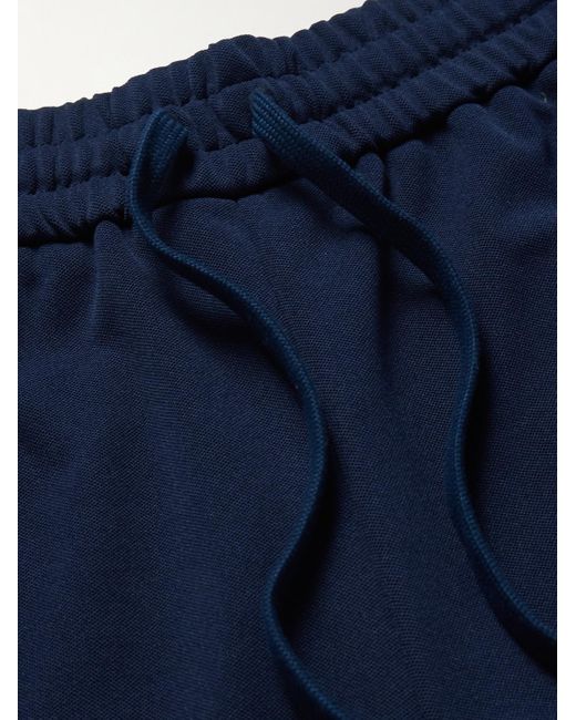 Pantaloni sportivi a gamba affusolata in jersey con righe e logo di Gucci in Blue da Uomo