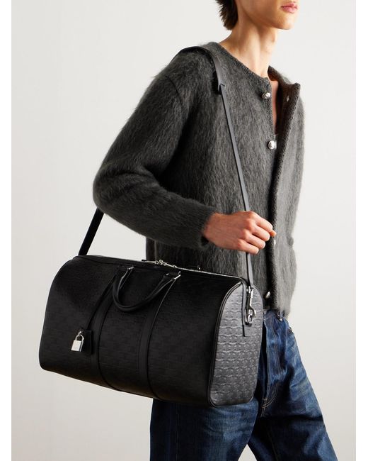 Medium Voyage Logo-Debossed Leather Holdall di Céline in Black da Uomo