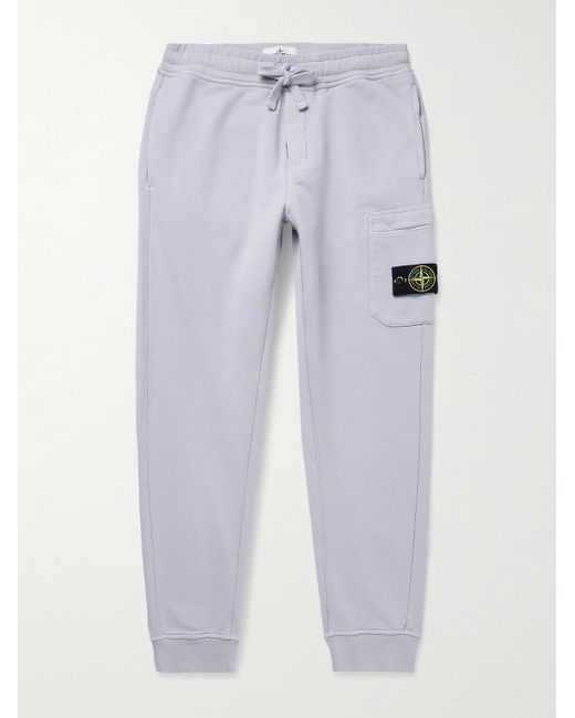 Stone Island Blue Tapered Logo-Appliquéd Garment-Dyed Cotton-Jersey Sweatpants for men