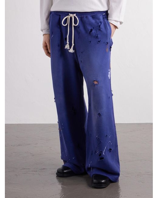 Satoshi Nakamoto Blue Luke Logo-Printed Paint-Splattered Distressed Cotton-Jersey Drawstring Sweatpants for men