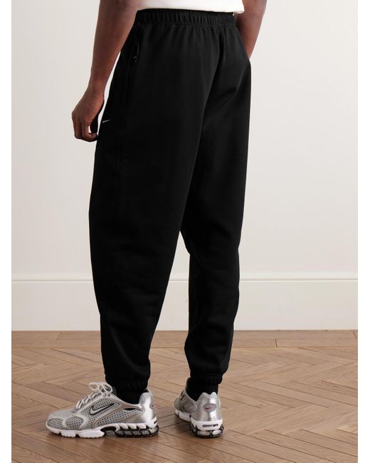 Nike Solo Swoosh schmal zulaufende Jogginghose aus Jersey aus einer Baumwollmischung mit Logostickerei in Black für Herren