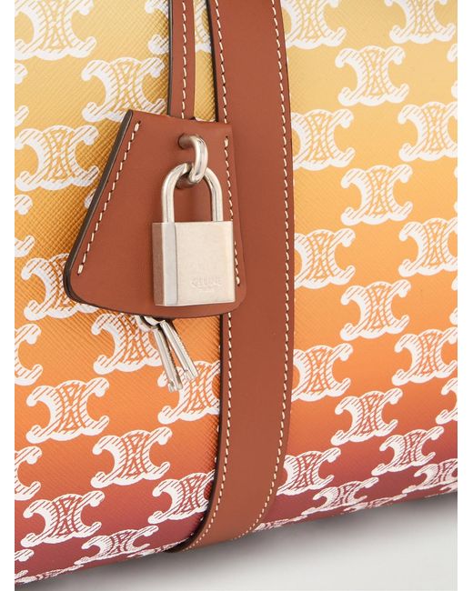 Medium Voyage Leather-Trimmed Logo-Print Coated-Canvas Holdall di Céline in Natural da Uomo