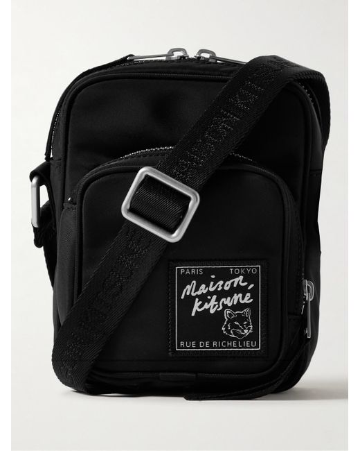 Pochette in nylon con logo applicato The Traveller di Maison Kitsuné in Black da Uomo