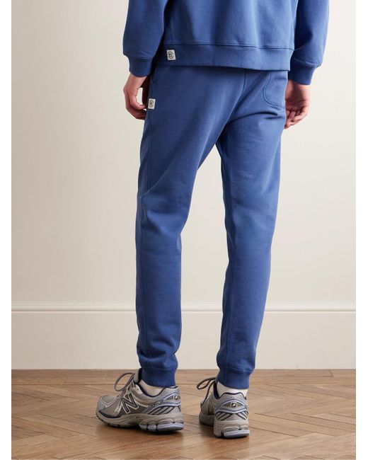Pantaloni sportivi a gamba affusolata in jersey di cotone con logo applicato di Reigning Champ in Blue da Uomo